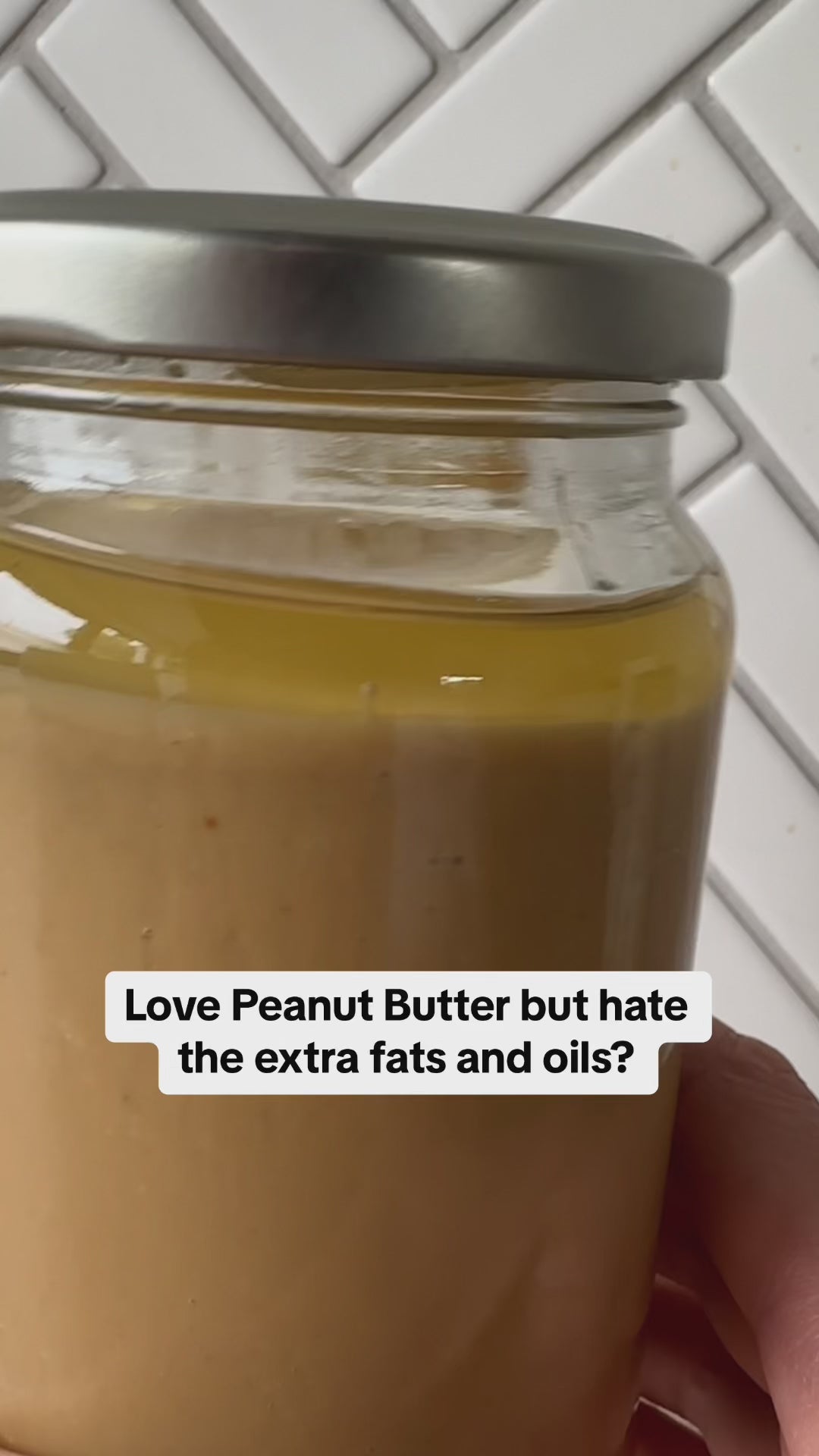 Video of oily peanut butter swirling around in jars, peanut butter powder as a healthy alternative without the additional fats and oils.